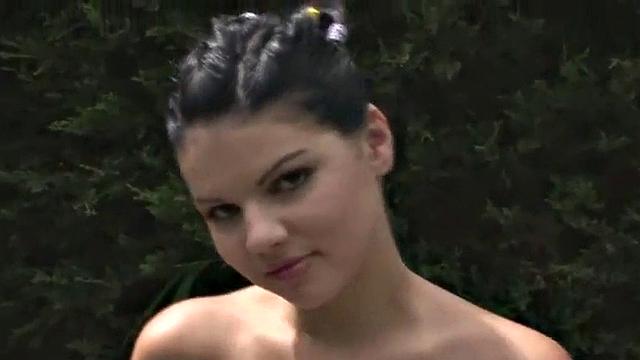 Busty teen masturbates outdoors