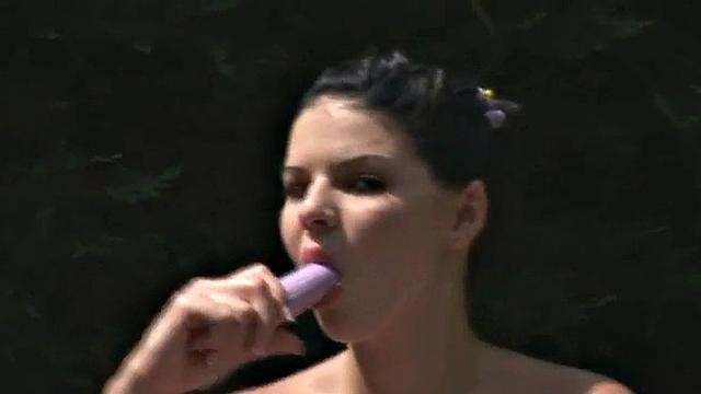 Busty teen masturbates outdoors