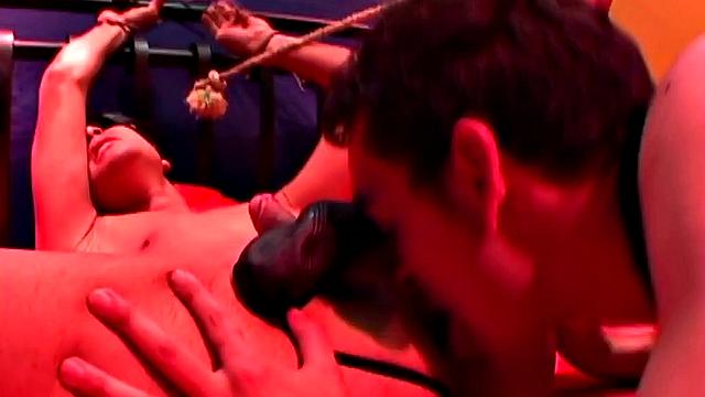 This kinky leather and bondage scene features young Damian in the dominant role, with skinny and smooth Cristobal in submission. ties the boy to a bed, and plays with his cock, while making the hooded bottom suck his dick.