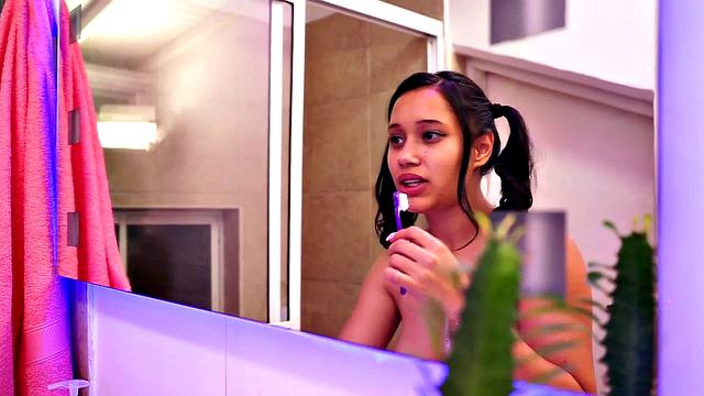 Hot Latina teen showers and shows tits