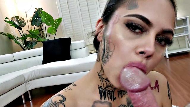 Teasing inked babe sucking her man's big cock
