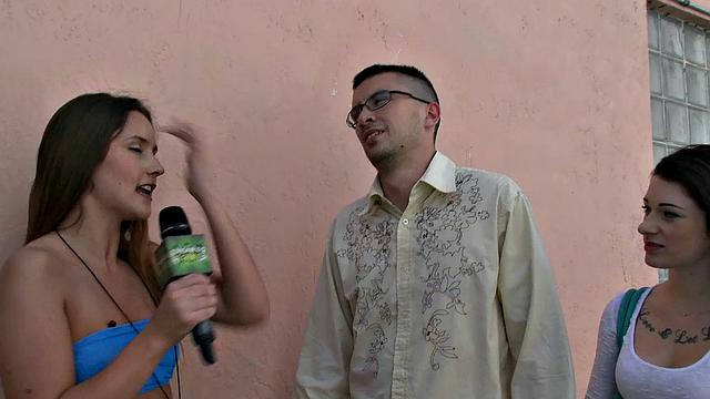 A tattooed babe pleasure herself with a wild threesome while wearing shorts and glasses