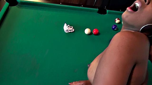 Amateur babe with big tits and black hair takes a wild ride in the billiards room