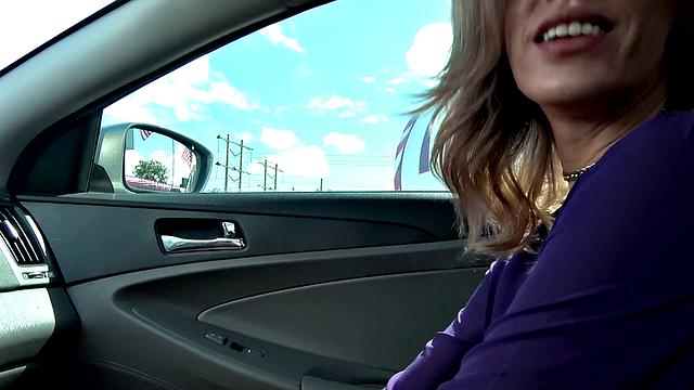 Get behind the wheel and get a taste of this tattooed babe's bald pussy in POV