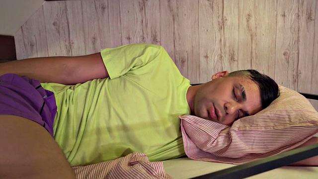 Busty ebony slut sharing cock with Asian in hostel 3some