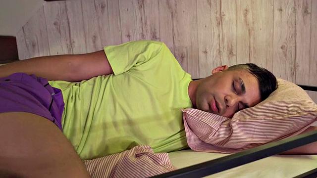 Busty ebony slut sharing cock with Asian in hostel 3some