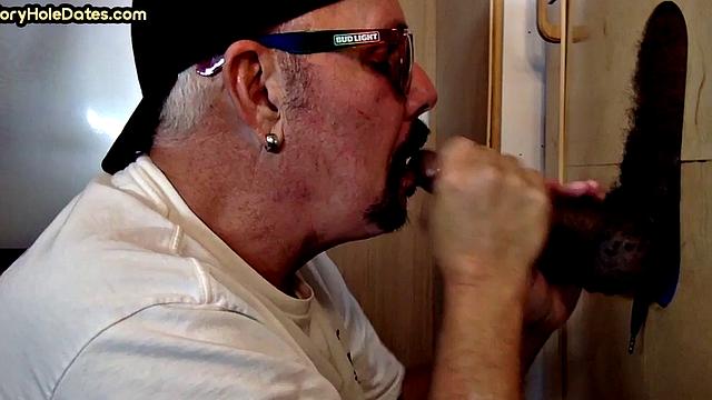 Gloryhole amateur gay sucks black penis at home