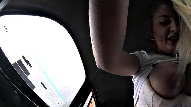 Blonde teen rubs her pussy while driving in reverse with glasses on & food in her mouth