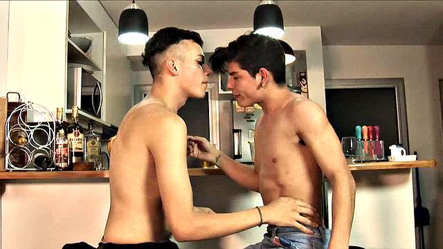 While enjoying their drinks, these two slim and young Latinos are quick to start making out, and in no time Adrian has his lips wrapped around Dylan's big uncut cock.