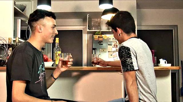 While enjoying their drinks, these two slim and young Latinos are quick to start making out, and in no time Adrian has his lips wrapped around Dylan's big uncut cock.