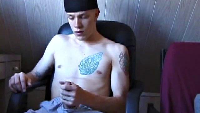 After skateboarding, Shane relaxes and strokes off, finding inspiration on the computer and massaging his dick. He pulls off his shorts, lubes up, and works his cock and balls.