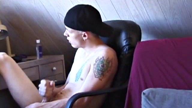 After skateboarding, Shane relaxes and strokes off, finding inspiration on the computer and massaging his dick. He pulls off his shorts, lubes up, and works his cock and balls.