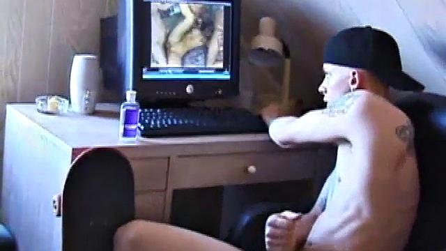 After skateboarding, Shane relaxes and strokes off, finding inspiration on the computer and massaging his dick. He pulls off his shorts, lubes up, and works his cock and balls.