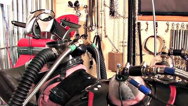 BDSM domina in leather pumping sub's pathetic cock