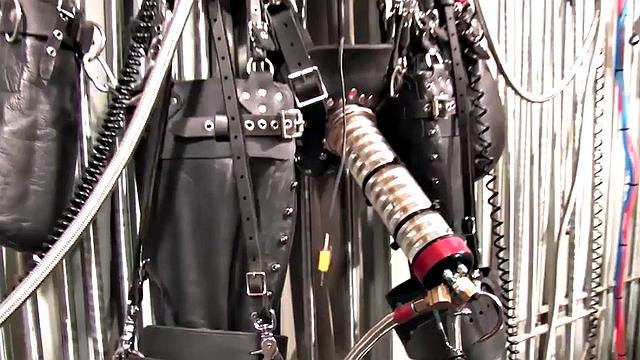 BDSM domina in leather pumping sub's pathetic cock