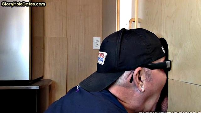 Bottom DILF gives head in gloryhole blowjob