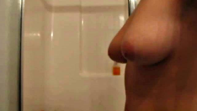 Curvy brunette teen touches herself in the shower