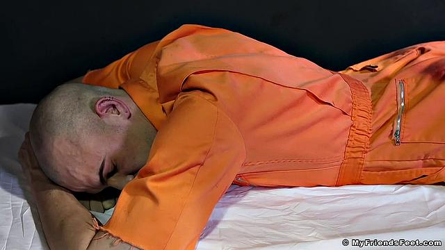 Prison guard Rikk dominates and gets worshiped by a hungry inmate