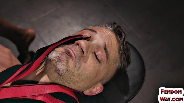 A kinky ebony femina tease and whip her male slave while wearing latex and showing off her feet