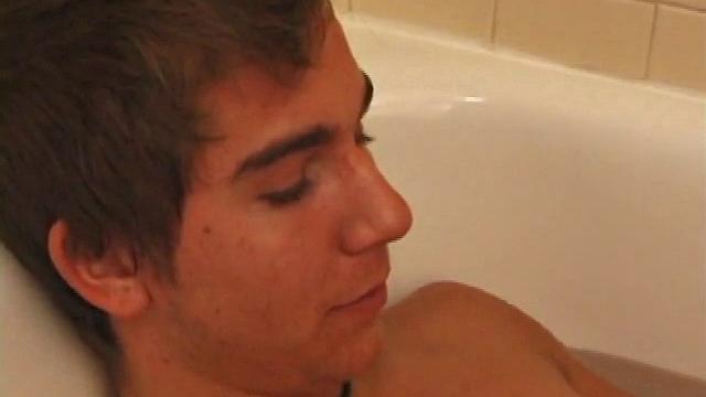 Brock is spending some down time in the bathtub reading a magazine and stroking his cock. After edging himself a few times, it doesn't take long to spew a warm load of cum onto his face.