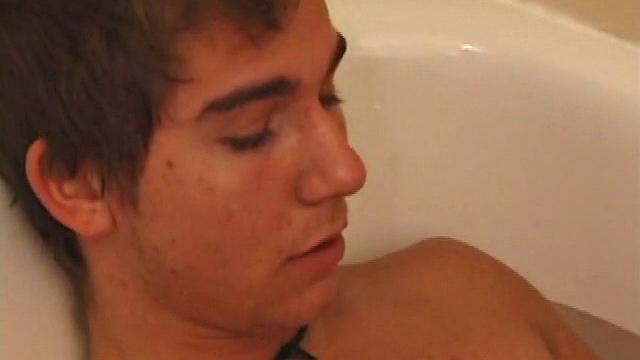Brock is spending some down time in the bathtub reading a magazine and stroking his cock. After edging himself a few times, it doesn't take long to spew a warm load of cum onto his face.