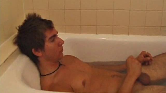 Brock is spending some down time in the bathtub reading a magazine and stroking his cock. After edging himself a few times, it doesn't take long to spew a warm load of cum onto his face.