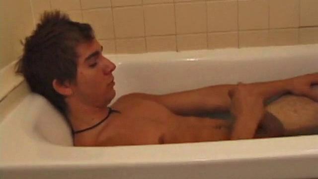 Brock is spending some down time in the bathtub reading a magazine and stroking his cock. After edging himself a few times, it doesn't take long to spew a warm load of cum onto his face.