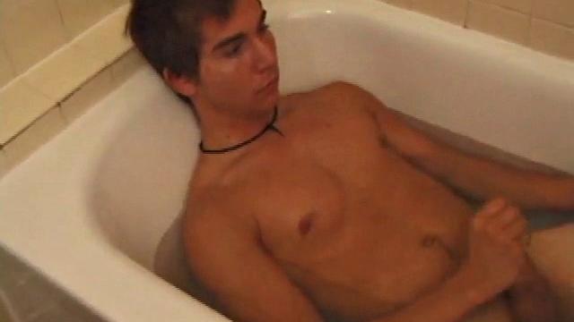 Brock is spending some down time in the bathtub reading a magazine and stroking his cock. After edging himself a few times, it doesn't take long to spew a warm load of cum onto his face.