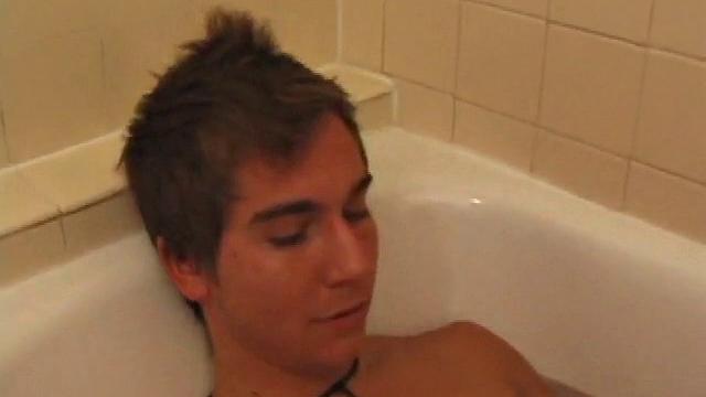 Brock is spending some down time in the bathtub reading a magazine and stroking his cock. After edging himself a few times, it doesn't take long to spew a warm load of cum onto his face.
