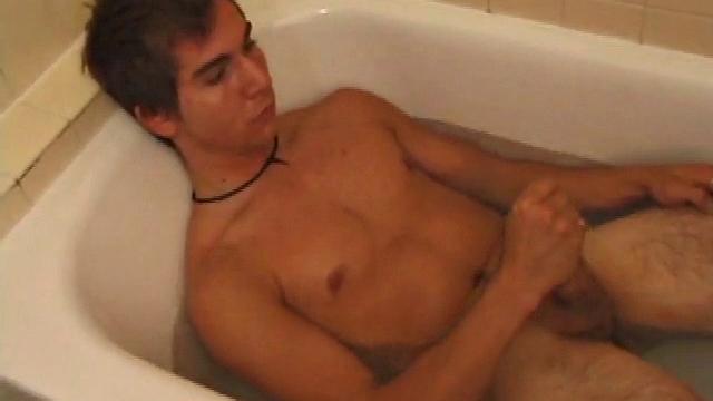Brock is spending some down time in the bathtub reading a magazine and stroking his cock. After edging himself a few times, it doesn't take long to spew a warm load of cum onto his face.