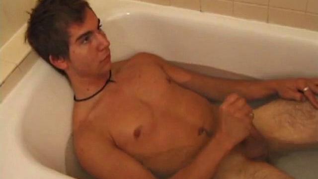 Brock is spending some down time in the bathtub reading a magazine and stroking his cock. After edging himself a few times, it doesn't take long to spew a warm load of cum onto his face.