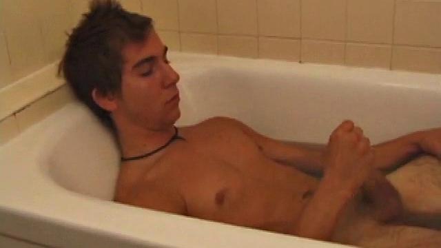 Brock is spending some down time in the bathtub reading a magazine and stroking his cock. After edging himself a few times, it doesn't take long to spew a warm load of cum onto his face.