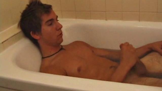 Brock is spending some down time in the bathtub reading a magazine and stroking his cock. After edging himself a few times, it doesn't take long to spew a warm load of cum onto his face.