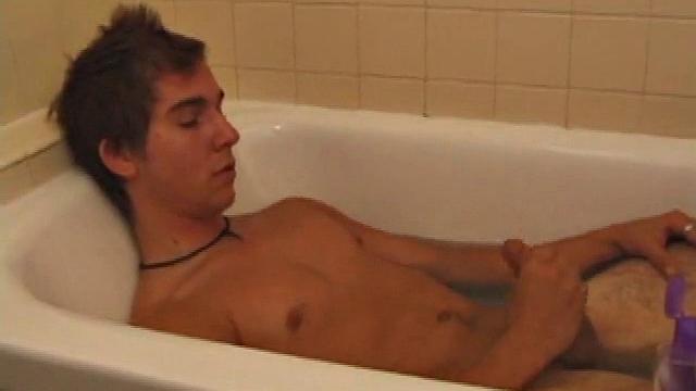 Brock is spending some down time in the bathtub reading a magazine and stroking his cock. After edging himself a few times, it doesn't take long to spew a warm load of cum onto his face.