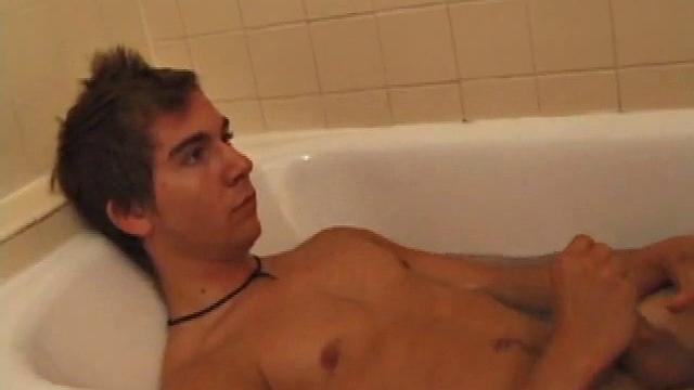Brock is spending some down time in the bathtub reading a magazine and stroking his cock. After edging himself a few times, it doesn't take long to spew a warm load of cum onto his face.