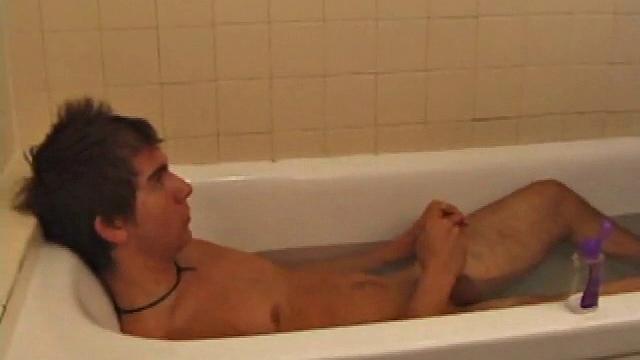 Brock is spending some down time in the bathtub reading a magazine and stroking his cock. After edging himself a few times, it doesn't take long to spew a warm load of cum onto his face.