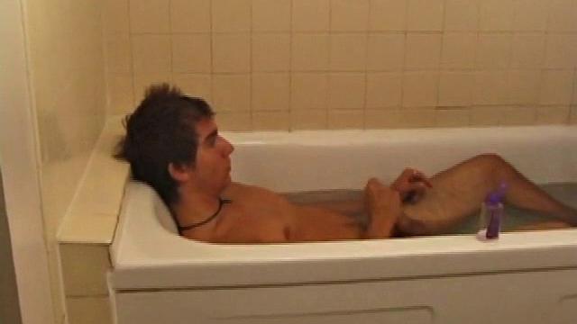 Brock is spending some down time in the bathtub reading a magazine and stroking his cock. After edging himself a few times, it doesn't take long to spew a warm load of cum onto his face.
