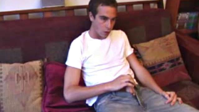 Back from shopping, Vincenzo is anxious to show off his new purchase. He strokes his cock on the sofa, before stripping his clothes off to show us his skater boy bpdy. Vincenzo brings out his new sex toy and begins lubing it up with his mouth.