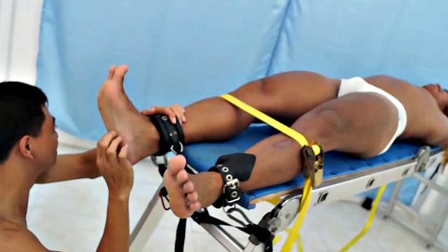 We strapped Hunter down on our tickling rack and released our sadistic ticklers Argie and Vahn on him. First was Argie.