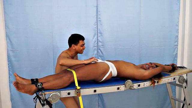 We strapped Hunter down on our tickling rack and released our sadistic ticklers Argie and Vahn on him. First was Argie.