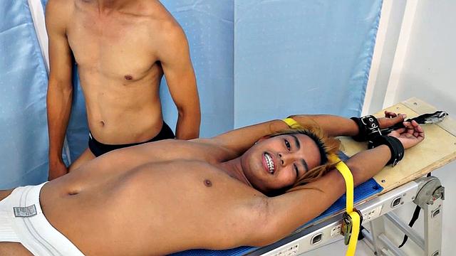 We strapped Hunter down on our tickling rack and released our sadistic ticklers Argie and Vahn on him. First was Argie.