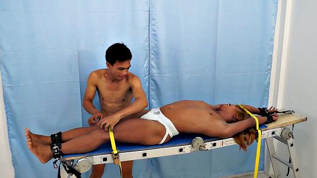 We strapped Hunter down on our tickling rack and released our sadistic ticklers Argie and Vahn on him. First was Argie.