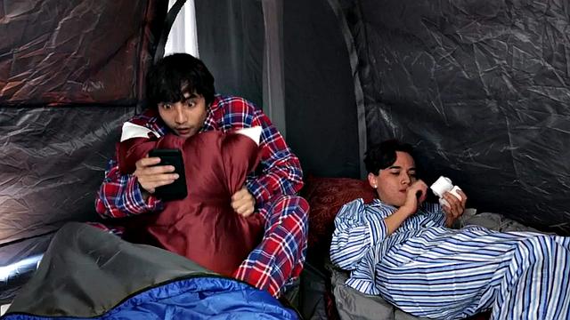 A tattooed MILF get her big tits spitroasted by a group of little guys in a wild threesome