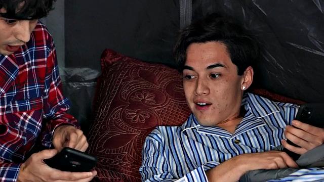 A tattooed MILF get her big tits spitroasted by a group of little guys in a wild threesome