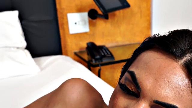 Latina with huge tits tugging on her man's dick after a steamy striptease