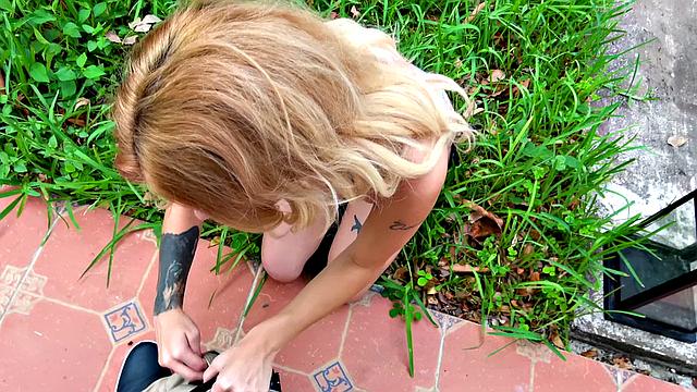 Watch this tattooed blonde babe with blue eyes fuck in public and get a cumshot