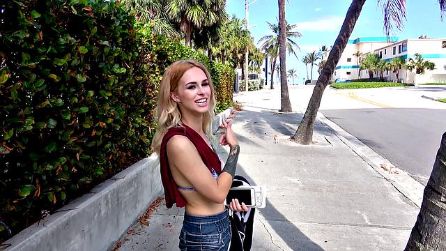 Watch this tattooed blonde babe with blue eyes fuck in public and get a cumshot