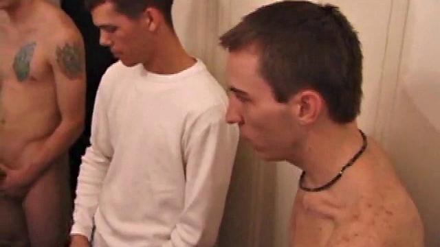 Eight guys lined up stroking like they're competing in the world's weirdest relay
