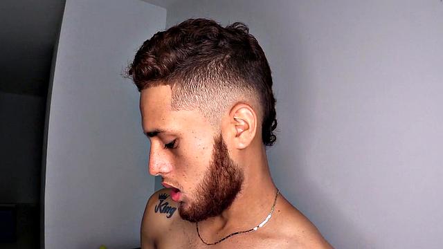 As the clothes hit the floor we discover this bearded red head is a skinny and smooth boy, who quickly gets hard. The young man jerks off his big cock. Then he continues his long stroke show.