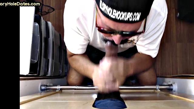 Gloryhole gay sucks hard cock while jerking it